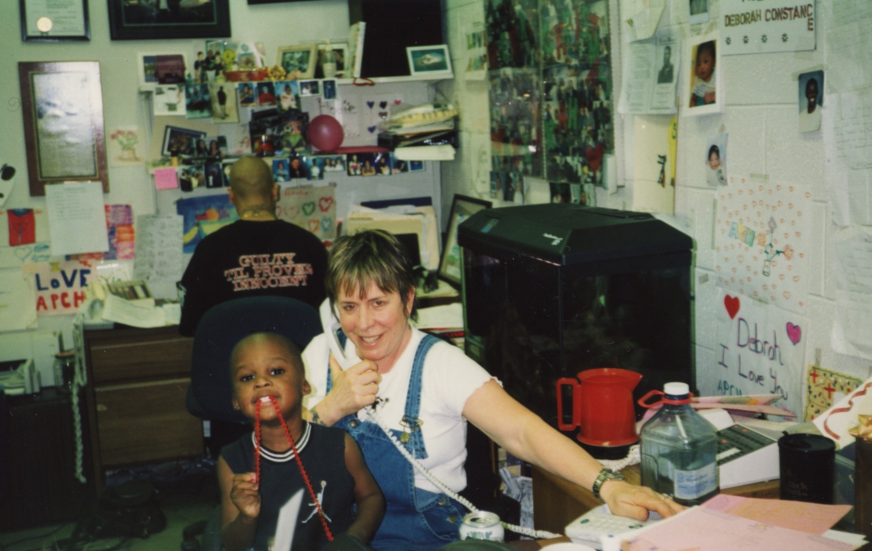 Historical photo of teacher and young student in classroom