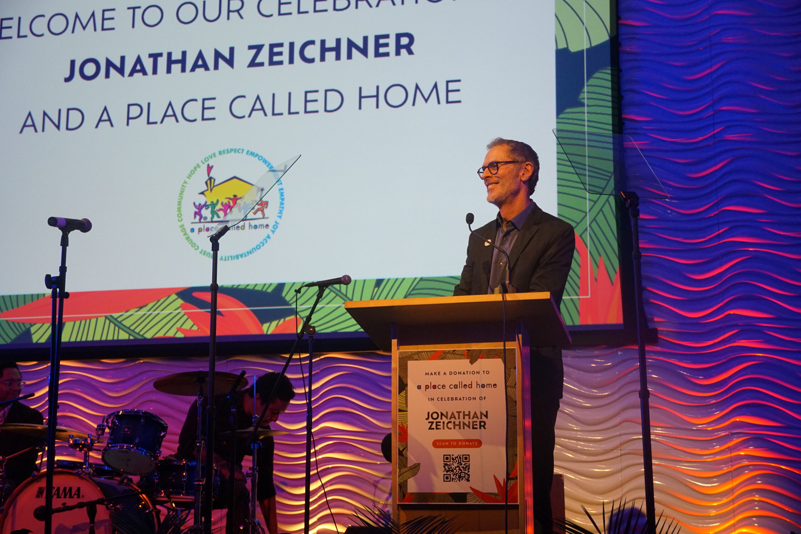 APCH Board member Bob Israel on stage as event host for the evening