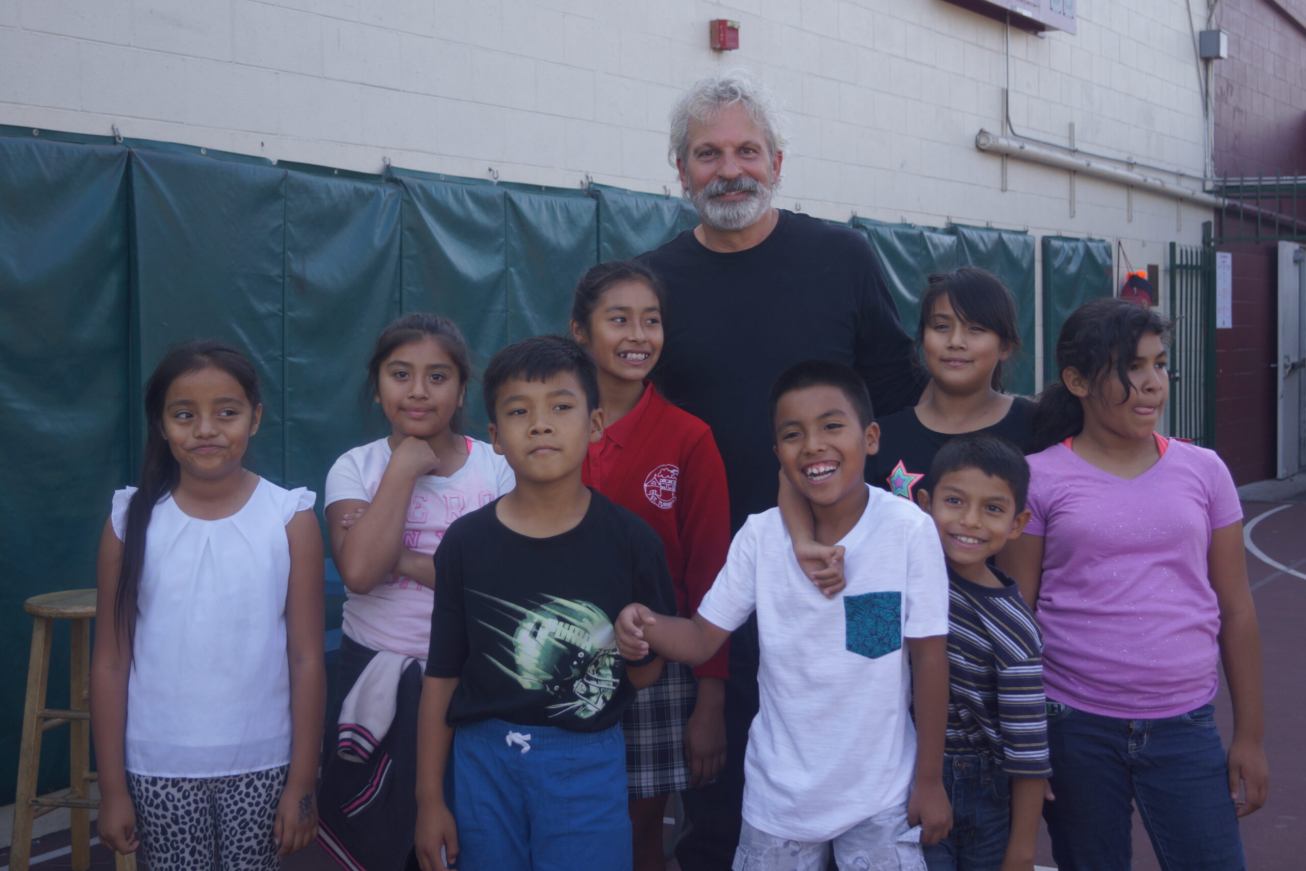 CEO smiling with kids outside