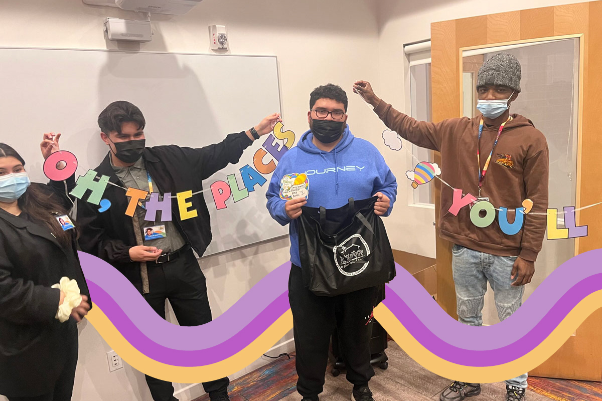 Four young adults holding a sign saying Oh The Places You'll Go Four young adults holding a sign saying Oh The Places You'll Go