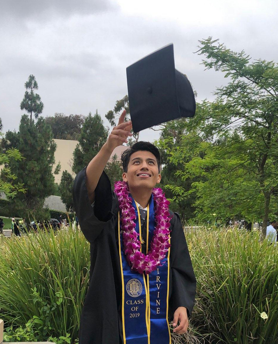 Graduate throwing cap