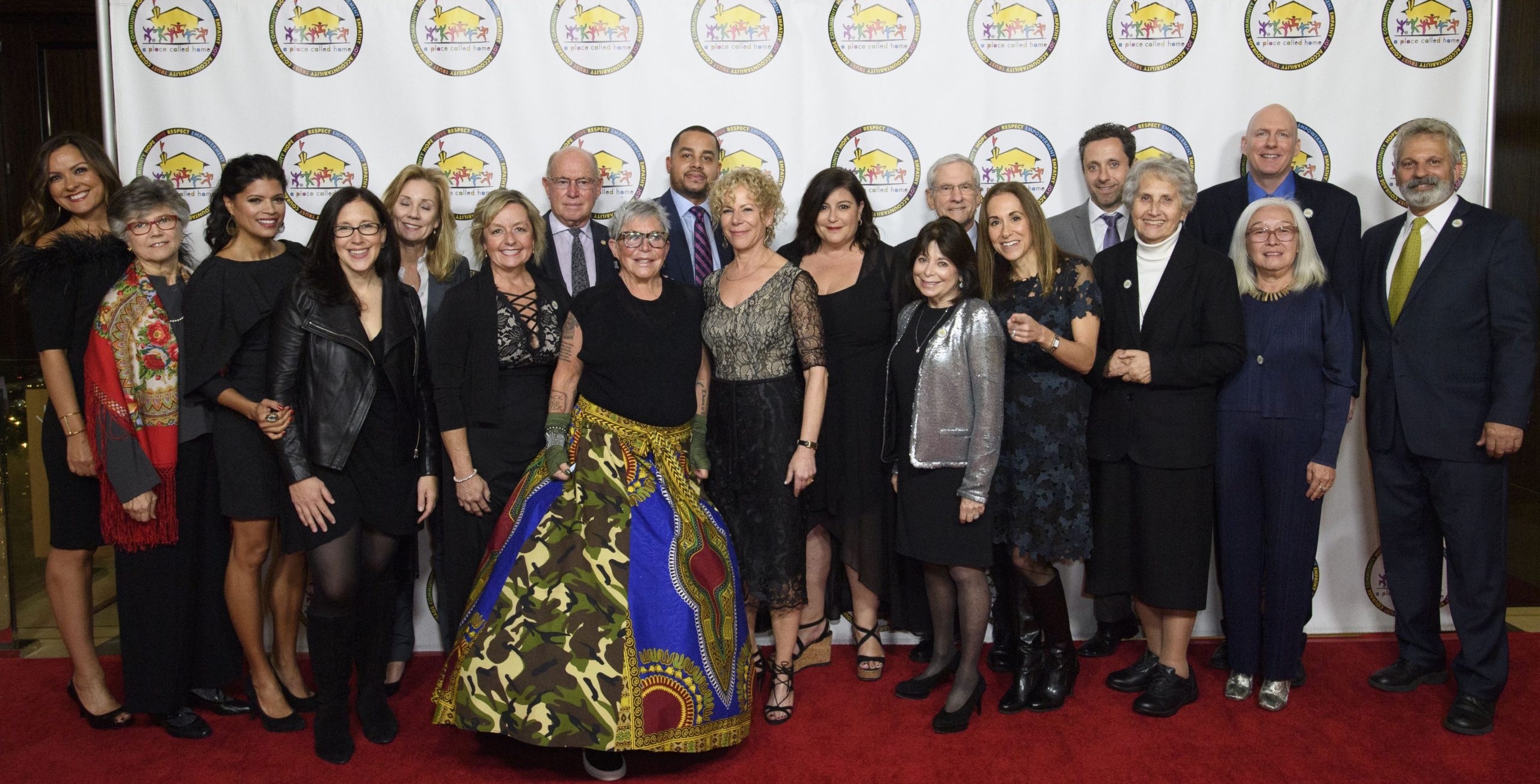 Board of Directors group image in front of step and repeat